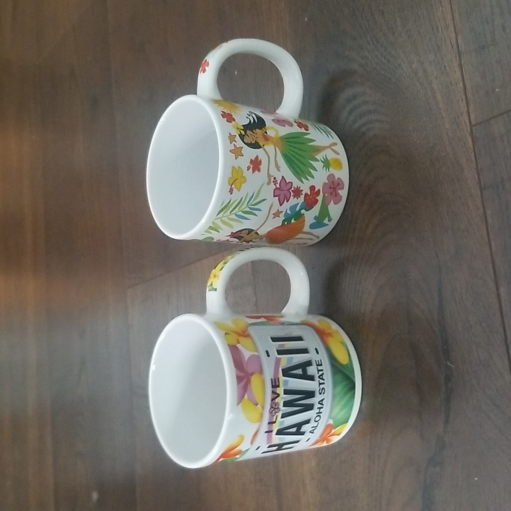 Pair of Hawaii coffee mugs, hula girls,  flowers.